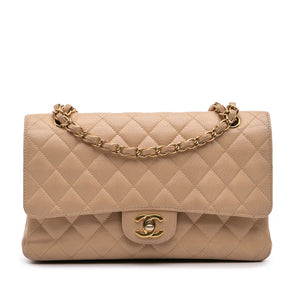 Das goldene Erbe: Wie Coco Chanels Geheimnisse die Double Flap Medium zur Ikone machten