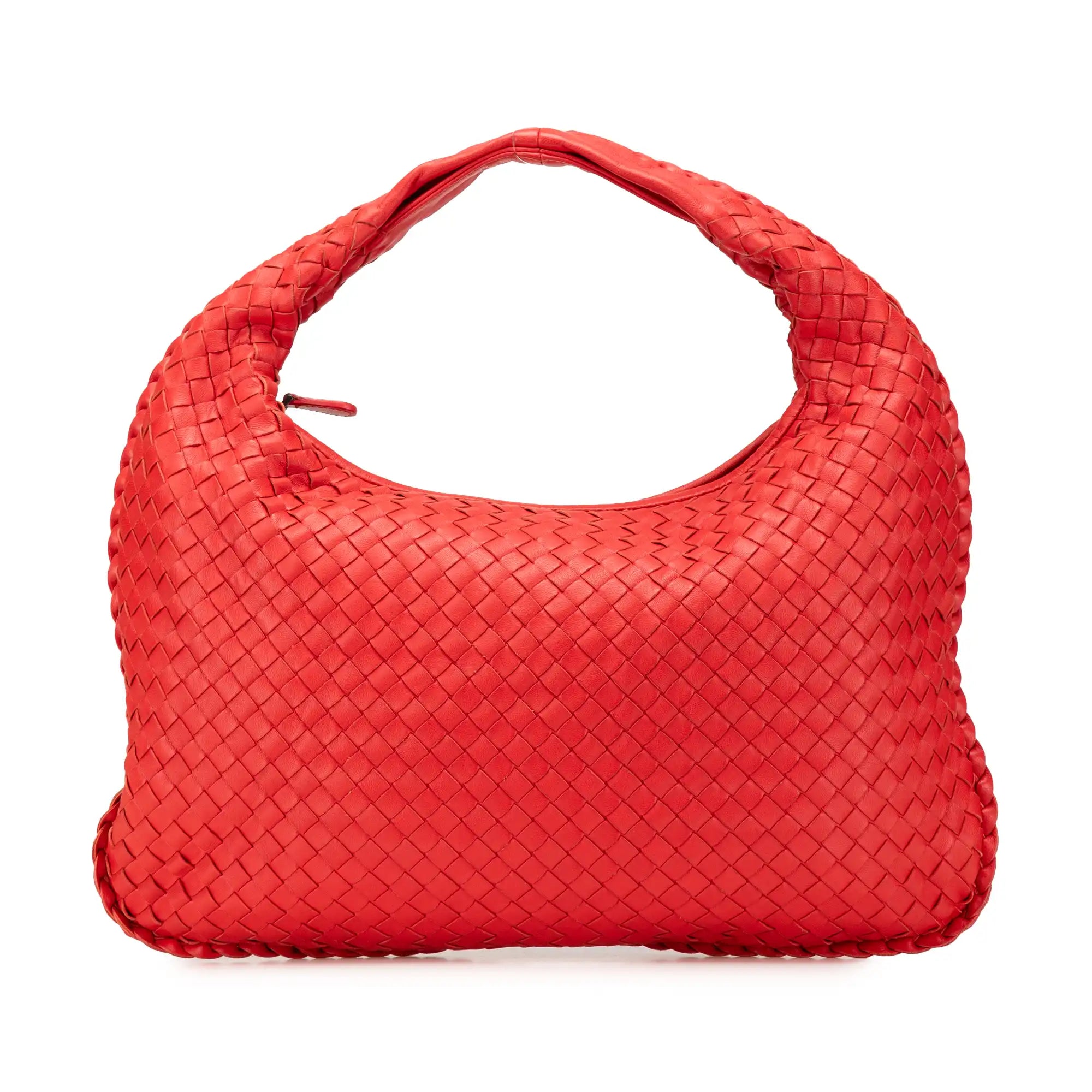 The legend of braided leather: Bottega Veneta's hobo bag in fiery red