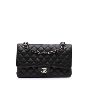 <h1>The timeless elegance: Chanel's 2.55 Revolution in black Kaviar</h1>