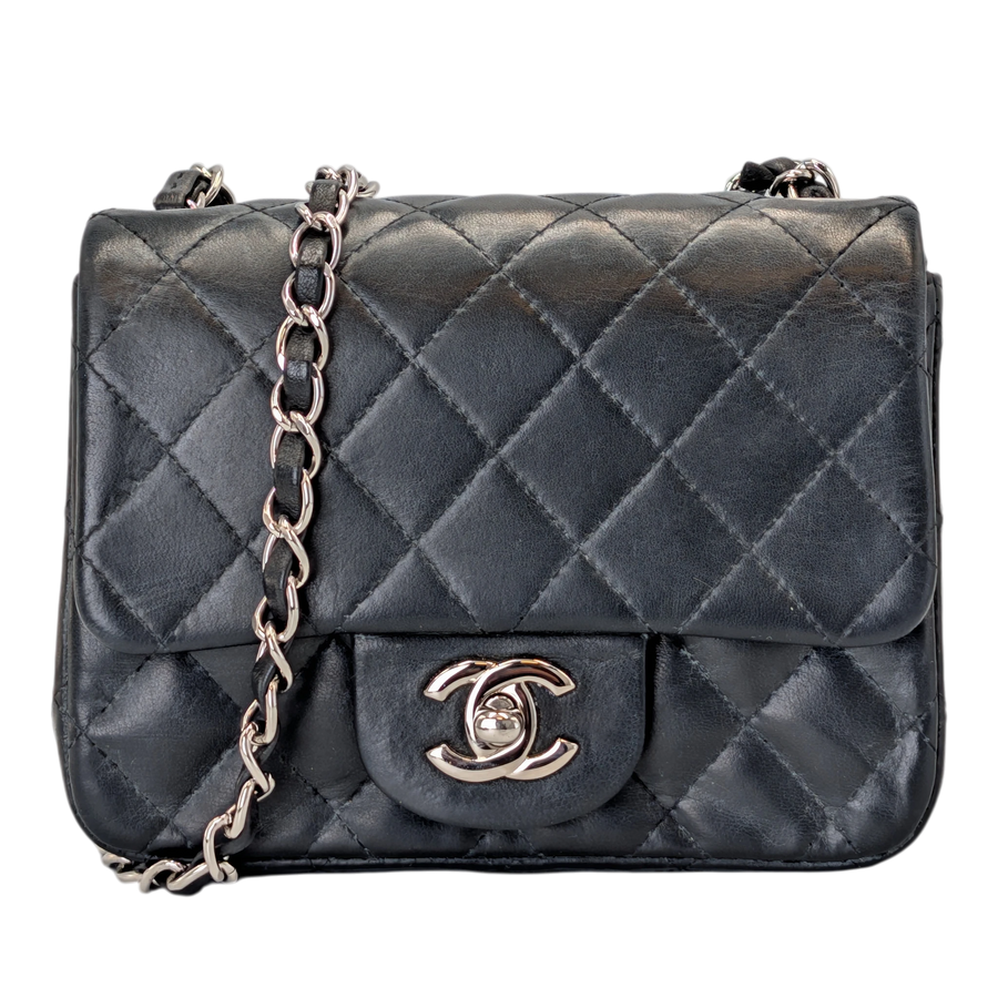 Secondhandbags AG black lambskin mini flap bag with silver hardware and diamond quilting.
