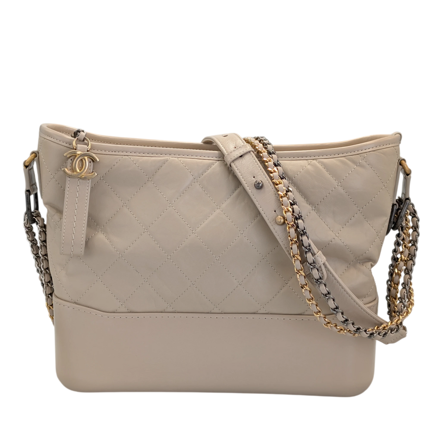 Secondhandbags AG Chanel Gabrielle Hobo Large cream leather bag with diamond quilting and gold chain straps.