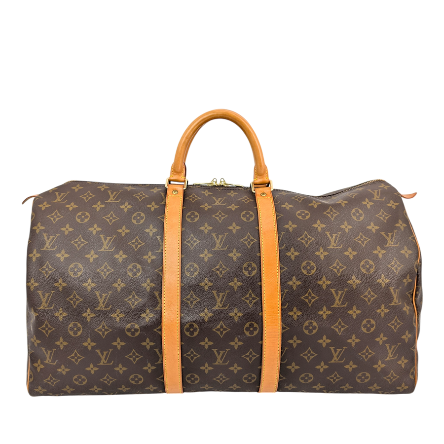 Secondhandbags AG Louis Vuitton Keepall 55 travel bag in brown monogram canvas with vachetta leather handles